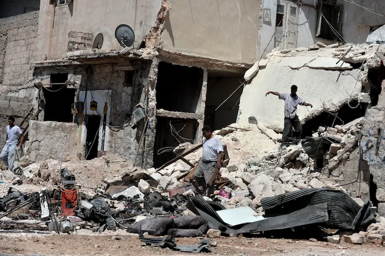 Civilians search for personal belongings in the rubble of their house following shelling from Syrian government forces in the Syrian northern city of Aleppo on Aug. 25. Syrian rebels say they are digging in for a war of attrition in Aleppo, where what was being billed as the 'mother of all battles' is now dragging on into a second month of bloody stalemate. (Aris Messinis/AFP/GettyImages)