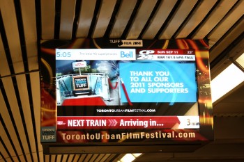 A screen at the Bloor-Yonge subway station displays a thank you ad from the organizers of the Toronto Urban Film Festival which runs Sept. 9-18. (Jeffrey Thompson/The Epoch Times)