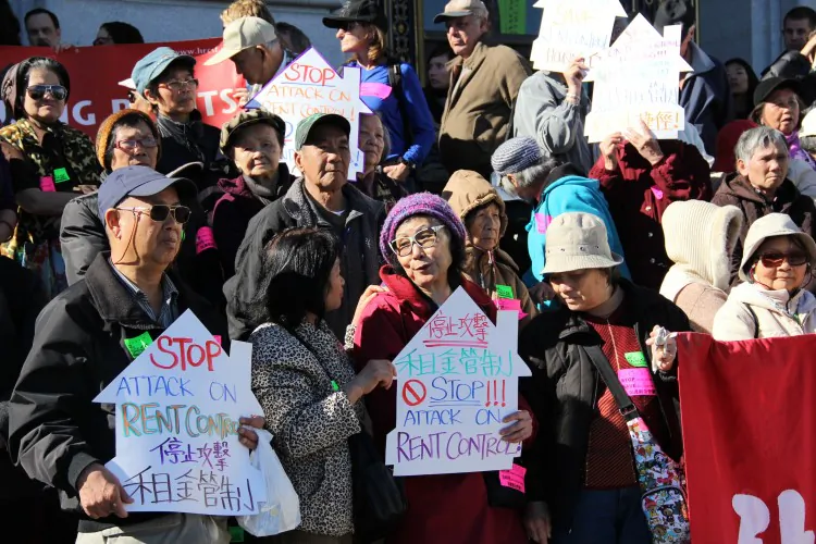 Members of the San Francisco Community Tenants Association and other groups protest proposed legislation in front of San Francisco City Hall on Jan. 28, 2013. They fear the ordinance would reduce the available rent-controlled rental stock and accelerate evictions in the city. (Christian Watjen/The Epoch Times)