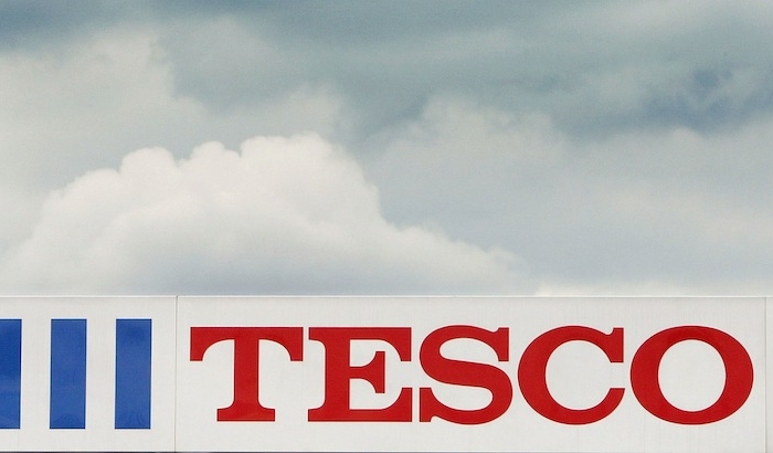 U.K. supermarket giant Tesco has pulled hamburger products from its shelves after inspectors found horse and pig meat in the beef products. The Tesco logo is seen outside a store on April 20, 2004 in London, England. (Scott Barbour/Getty Images)