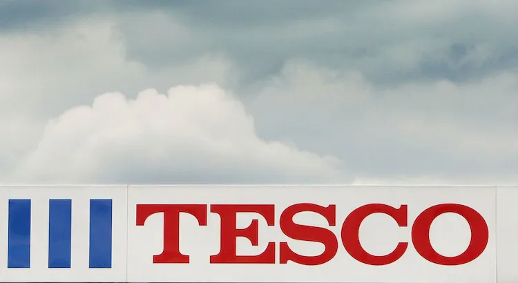 U.K. supermarket giant Tesco has pulled hamburger products from its shelves after inspectors found horse and pig meat in the beef products. The Tesco logo is seen outside a store on April 20, 2004 in London, England. (Scott Barbour/Getty Images)