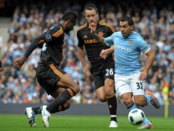 HARD WORK: Manchester City's Carlos Tevez (R) takes on Chelsea's John Obi Mikel (L) and John Terry. (Andrew Yates/AFP/Getty Images) HARD WORK: Manchester City's Carlos Tevez (R) takes on Chelsea's John Obi Mikel (L) and John Terry. (Andrew Yates/AFP/Getty Images)