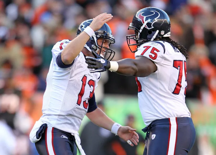 Quarterback T.J. Yates (13) and lineman Derek Newton (75) celebrate the win. (Andy Lyons/Getty Images)