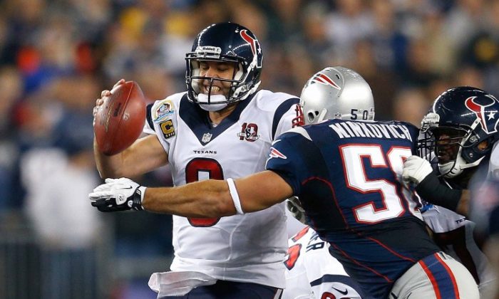 Houston Texans quarterback Matt Schaub is pressured by New England Patriots linebacker Rob Ninkovich. Schaub and the Texans had a game to forget in Foxborough, Mass. on Monday. (Jim Rogash/Getty Images)