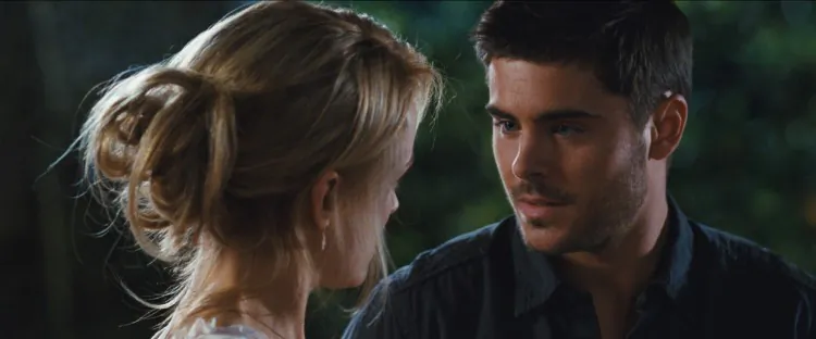 Taylor Schilling and Zac Efron in the drama “The Lucky One,” a film about a Marine who after serving three tours in Iraq searches for the woman he believes brought him good luck during the war. (Warner Bros. Pictures)