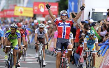 Norwegian Thor Hushovd of the Cervelo Test team celebrates as he crosses the finish line of the sixth stage of the Vuelta a Espagne. He beat Daniele Bennati (L), Grega Bole (pink sleeve, hidden by Hushovd,) and Allan Davis. (R) (Jose Jordan/AFP/Getty Images)