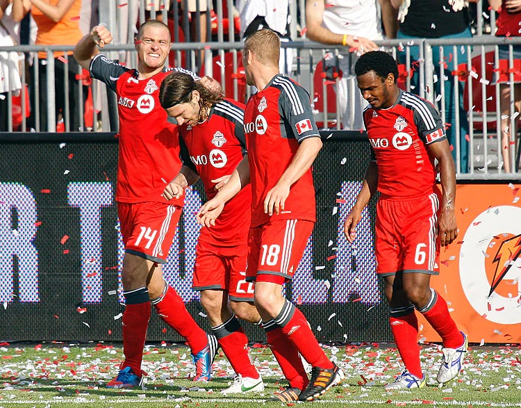 Toronto FC’s Danny Koevermans (L) celebrates with his teammates after scoring the game-winning goal against the Philadelphia Union at BMO Field on Saturday. (Abelimages/Getty Images)