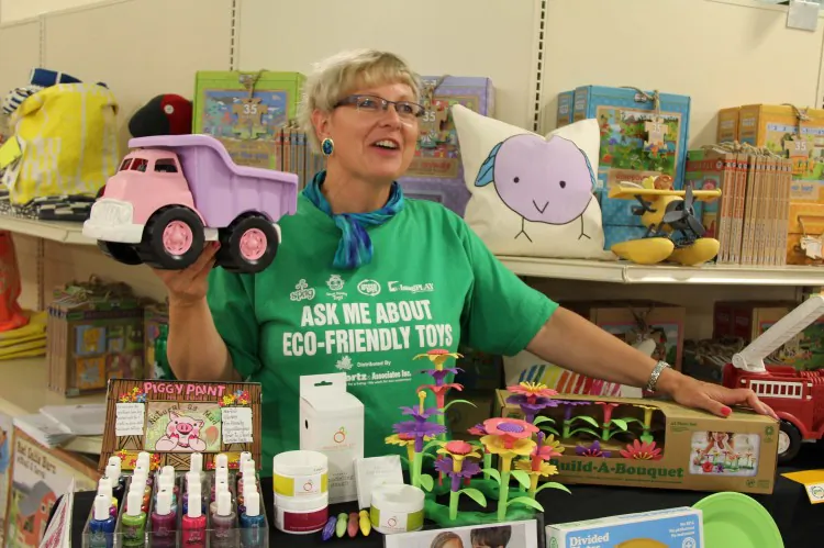 Linda Stotz demonstrates toys at terra20, some of which are made from recycled milk jugs. (Pam McLennan/The Epoch Times)