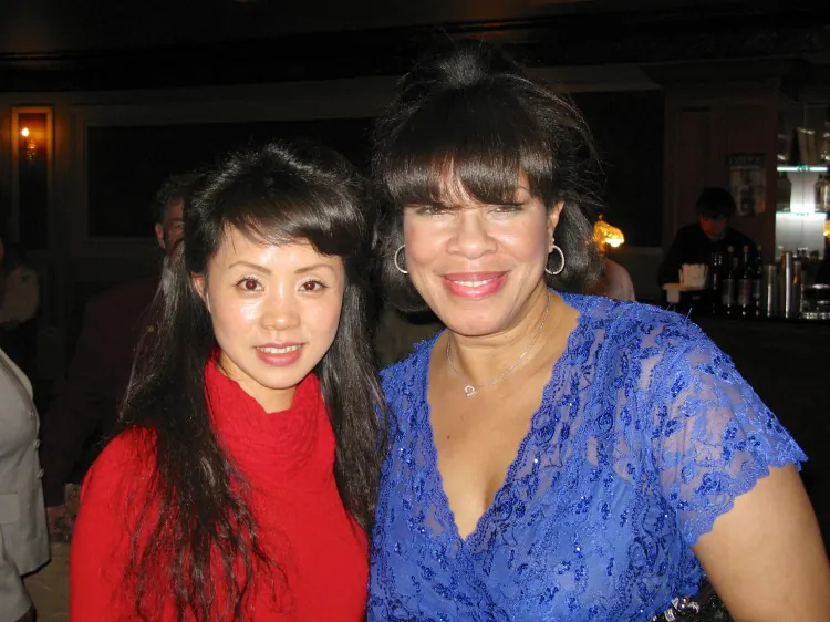Ting with Linnet Carty, a TV host, attends Shen Yun Performing Arts in Waterbury's Palace Theater. (Mike Chen/The Epoch Times)