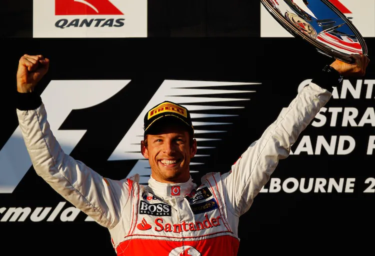 Jenson Button celebrates on the podium after winning the Formula One Australian Grand Prix. (Paul Gilham/Getty Images)