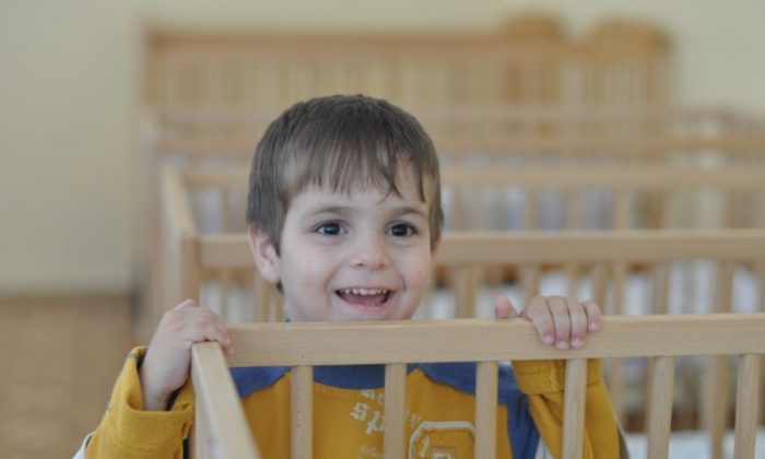 An orphan is seen in one of the over 300 orphanages in Ukraine. NGO's are helping disadvantaged families to prevent their children from being sent to orphanages. (Courtesy Partnership 4 Every Child)