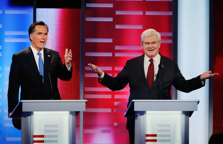 Former Massachusetts Gov. Mitt Romney (L) attacks former Speaker of the House Newt Gingrich (R) during a debate on Dec. 10. (Kevork Djansezian/Getty Images)