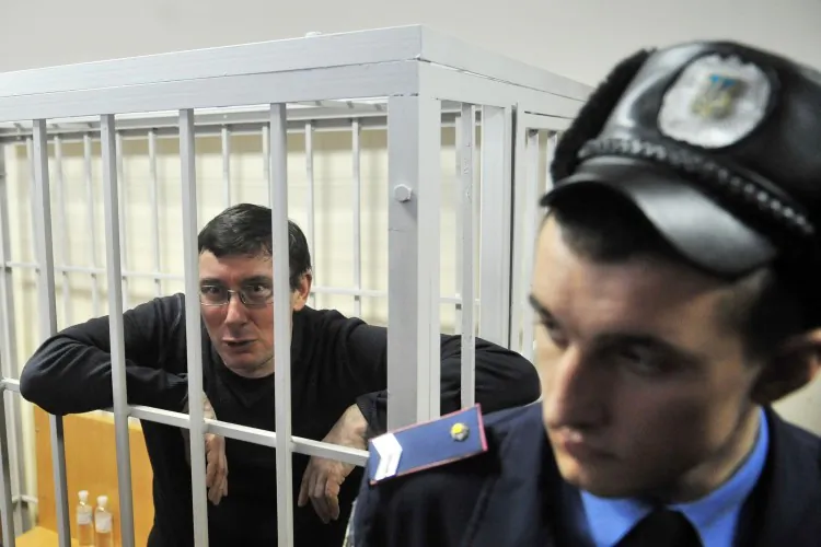 Former Ukrainian Interior Minister Yuriy Lutsenko , sits in a cage inside the courtroom during his verdict hearing on Feb 27. (Sergei Supinsky/AFP/Getty Images)