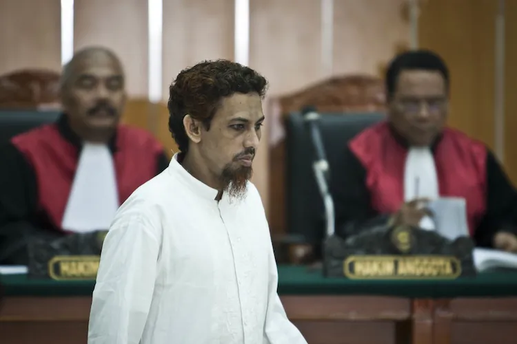 Convicted bombmaker Umar Patek walks into the court room during verdict trial on June 21, in Jakarta, Indonesia. Patek was convicted of assembling the explosives that killed 202 people in Bali on Christmas Eve 2002. (Ulet Ifansasti/Getty Images)