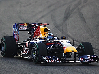 FORMULA ONE GOING GREEN: Formula One World Champion Sebastian Vettel drives during the 2010 Abu Dhabi Formula One Grand Prix. Starting in 2013, his engine will have half as many cylinders. (Paul Gilham/Getty Images)