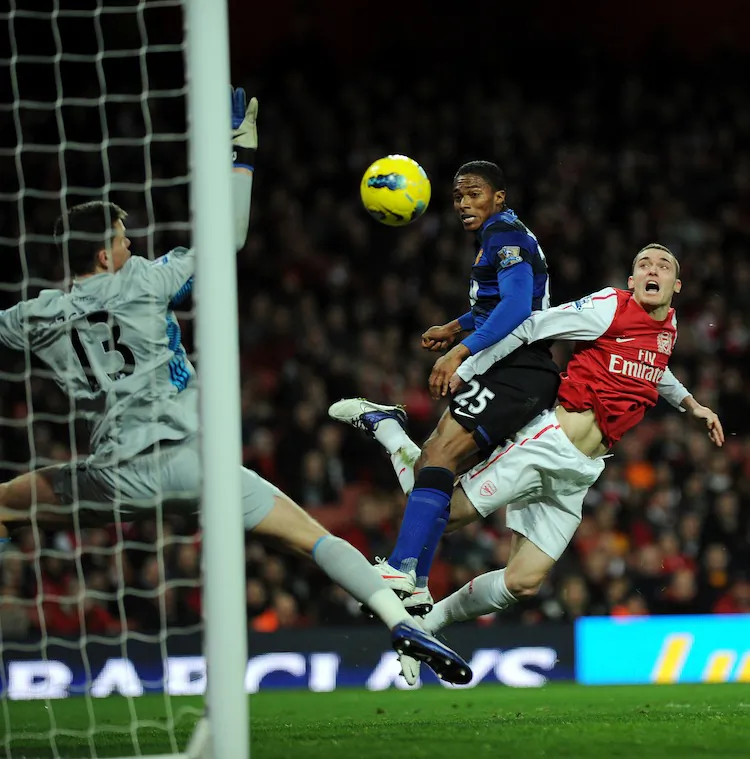 Arsenal’s Robin Van Persie reacts in frustration after firing high and wide early in the second half. (Adrian Dennis/AFP/Getty Images)