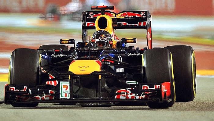 McLaren Mercedes driver Lewis Hamilton (R) leads the start of Formula One's Singapore Grand Prix on September 23, 2012. (Punit Paranjpe/AFP/GettyImages)