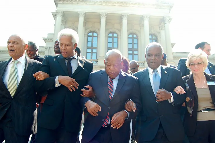 Southern Christian Leadership Conference President C. T. Vivian, Rep. Hank Johnson (D-Ga.), Congressman John Lewis (D-Ga.), Rep. David Scott (D-Ga), and League of Women Voters of Georgia President Elizabeth Poythress descend the state Capitol steps to march to the Fulton County Voter Registrar's office. (Mary Silver/Epoch Times)