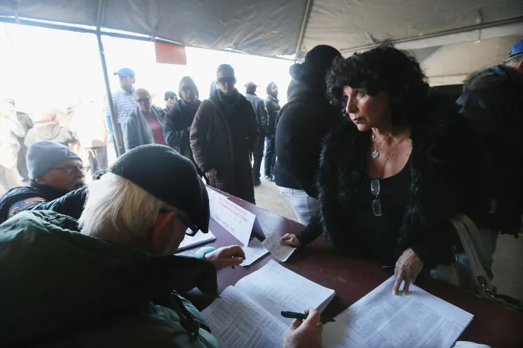 After waiting in line outside MS 51 school, people wait inside to register to vote in Brooklyn, New York City, on Nov. 6. Many people complained that they waited over two hours to vote. (Benjamin Chasteen/The Epoch Times)