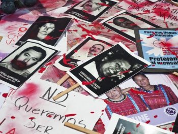 MURDERED: Mexican journalists protest against violence toward journalists in Mexico placing on the ground pictures of murdered journalists, on Aug. 7, in Mexico City. (Ronaldo Schemidt/Getty Images ) MURDERED: Mexican journalists protest against violence toward journalists in Mexico placing on the ground pictures of murdered journalists, on Aug. 7, in Mexico City. (Ronaldo Schemidt/Getty Images )
