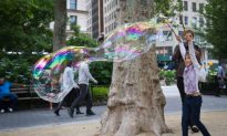 Children Make Large Bubbles in the Park