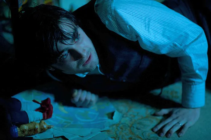 Daniel Radcliffe in “The Woman in Black,” as a young widowed lawyer who travels to a remote village and discovers a vengeful ghost that is terrorizing the locals. (CBS Films Inc.)