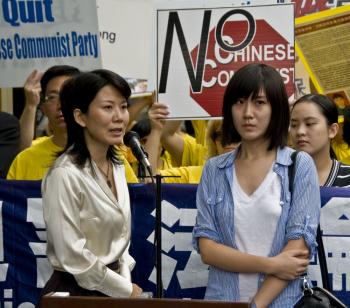 Ms. Weidi Wang, a 20-year-old fashion design student (R), prepares to give a speech on behalf of her mother Shao Jie Qiu, 46, who is imprisoned in China for her spirtual belief in Falun Gong. (Aloysio Santos/The Epoch Times) Ms. Weidi Wang, a 20-year-old fashion design student (R), prepares to give a speech on behalf of her mother Shao Jie Qiu, 46, who is imprisoned in China for her spirtual belief in Falun Gong. (Aloysio Santos/The Epoch Times)