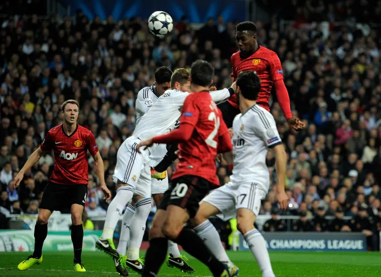 Manchester United striker Danny Welbeck rises above the crowd to score with a header against Real Madrid in Champions League action on Feb. 13, 2013 in Madrid. (Gonzalo Arroyo Moreno/Getty Images)