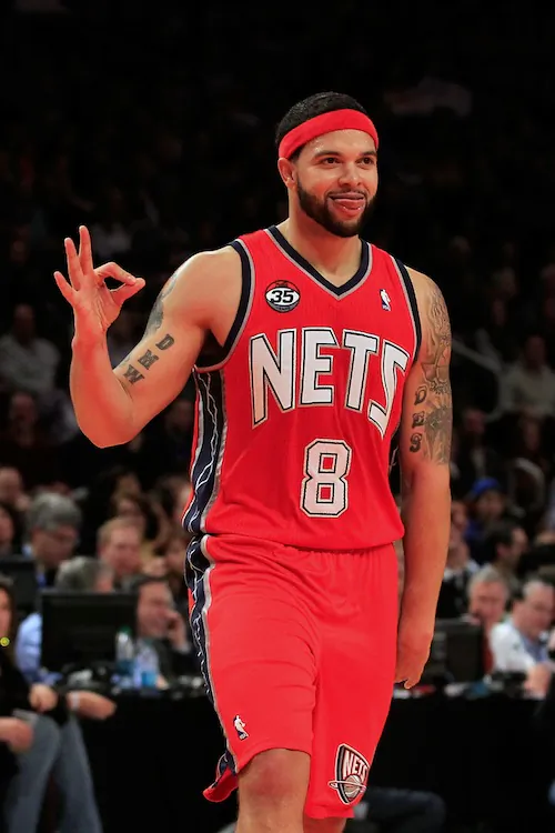 Deron Williams will stay with the Nets and their re-vamped roster. (Chris Trotman/Getty Images)