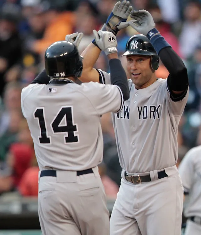 Curtis Granderson (L) and Derek Jeter have been a big part of the Yankees' run this season. (Leon Halip/Getty Images)
