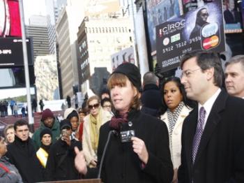 GETTIN' PAID: New York City Department of Transportation Commissioner Janette Sadik-Khan demonstrates one of the 2,000 prepaid debit cards that will be distributed to New Yorkers during the holiday season. These cards are redeemable in taxis, car services (Lixin Shi/The Epoch Times)