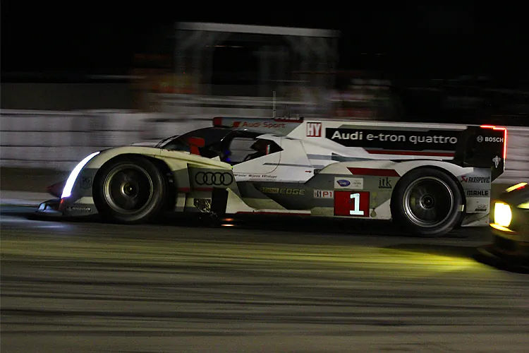 Tom Kristensen in the #2 Audi is chasing its team car, the #1; both Audis are five laps ahead of the third-place Rebellion in the last hour of the Sebring 12 Hours. (James Fish/The Epoch Times)