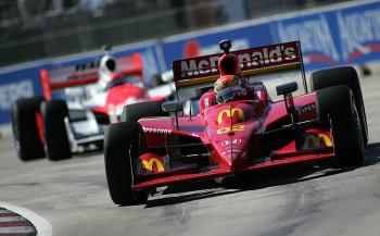 Justin Wilson easily pulled away from Helio Castroneves after race officials told Helio to let him by. (Marc Serota/Getty Images) Justin Wilson easily pulled away from Helio Castroneves after race officials told Helio to let him by. (Marc Serota/Getty Images)