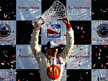 Justin Wilson celebrates with second-placed Helio Castroneves (L) and third-placed Tony Kanaan (R) after winning the IRL IndyCar Series Detroit Indy Grand Prix. (Darrell Ingham/Getty Images) Justin Wilson celebrates with second-placed Helio Castroneves (L) and third-placed Tony Kanaan (R) after winning the IRL IndyCar Series Detroit Indy Grand Prix. (Darrell Ingham/Getty Images)