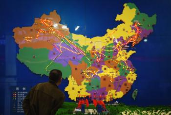 A Chinese visitor watches the map of the Chinese petroleum pipeline on March 21 in Beijing, China. Part of the distrust toward China involves territorial disputes with India to the west and Russia to the north. (Feng Li/Getty Images)