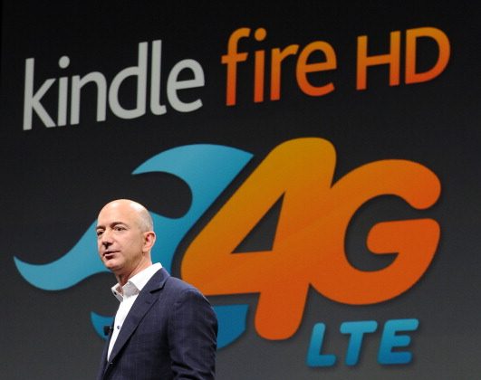 Jeff Bezos, CEO of Amazon.com, introduces the new Kindle Fire HD Family and Kindle Paper white during an Amazon press conference on September 06, 2012, in Santa Monica, California. Six months later, the company is slashing prices for the device, because it can pass on cost savings to customers. (Joe Klamar/AFP/GettyImages)