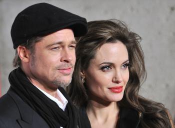 Angelina Jolie and Brad Pitt pose as they arrive for the premiere of her movie The Tourist by German director Florian Henckel von Donnersmarck in Rome on December 15, 2010. (Alberto Pizzoli/AFP/Getty Images)