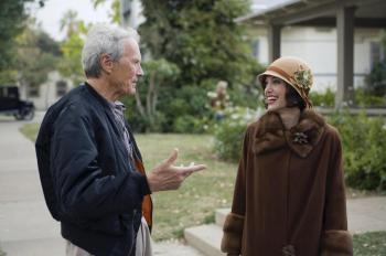 Director/producer Clint Eastwood shares a moment with actress Angelina Jolie between takes while filming Director/producer Clint Eastwood shares a moment with actress Angelina Jolie between takes while filming