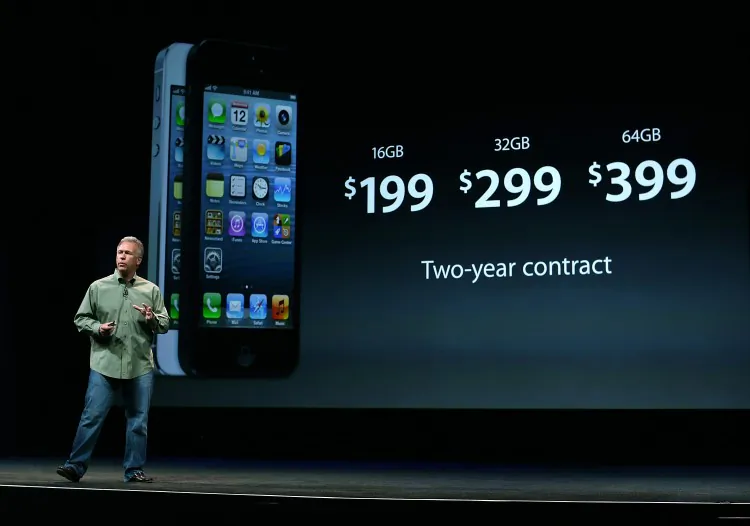 Apple Senior Vice President of worldwide product marketing Phil Schiller reveals the iPhone 5 during an Apple special event in San Francisco, California, September 2012. Shortly after the share price peaked and investors started questioning whether the company can keep prices and margins high. Edward Zabitsky of ACI research is one of two analysts who predicted the share price decline. (Justin Sullivan/Getty Images)