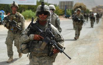 US soldiers patrol jointly with Canadian soldiers and the Afghan National Army in Kandahar's province Arghandab Valley on August 10. Soldiers will now be issued new uniforms that are both fire and flea resistant. (Yuri Cortez/Getty Images)