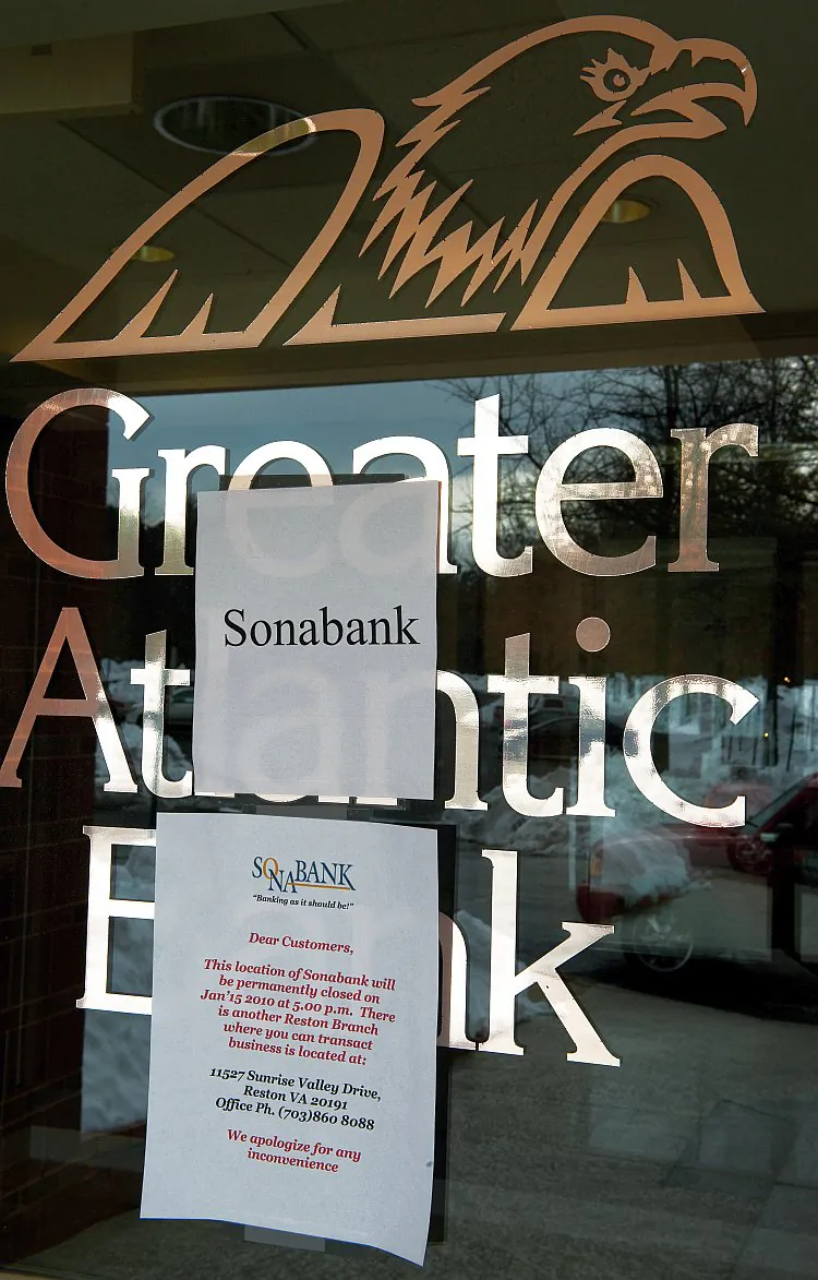 This file photo shows the door to the Greater Atlantic Bank, Reston, Va., that was closed in 2009 by the Office of Thrift Supervision, and had the FDIC appointed as receiver. The sign on the door states that this location would be permanently closed. (Paul J. Richards/AFP/Getty Images)