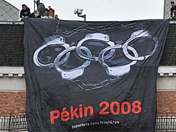 Reporters Without Borders, Paris-based international non-governmental organization that advocates freedom of the press, display a banner calling for boycott of the 2008 Olympic Games in Beijing during a European Summit in front of the headquarters of the  (Dominique Faget/AFP/Getty Images)