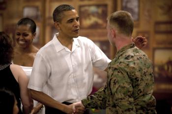 U.S. President Barack Obama and First Lady Michelle Obama greet members of the military and their families at Anderson Hall at Marine Corps Base Hawaii on Christmas Day (Dec. 25) in Kaneohe, Hawaii. (Kent Nishimura/Pool/Sipa Press USA)