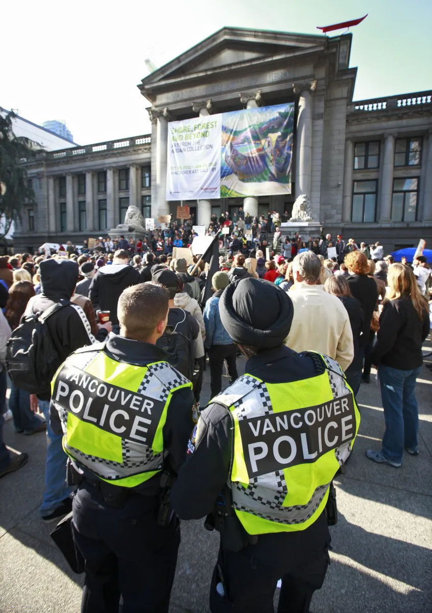 Vancouver police keep their eyes on protesters at the Vancouver Art Gallery during the Occupy Vancouver protest on October 15, 2011. The civilian-led Independent Investigations Office (IIO) is set to start operations in B.C. on Sept. 10. (Jeff Vinnick/Getty Images)