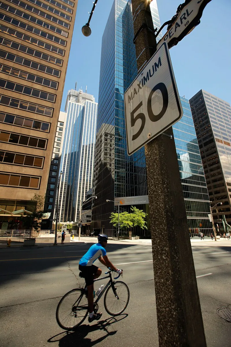 A report by Toronto's chief medical officer David McKeown says speed limits should be lowered in the city to increase pedestrian and cyclist safety. (Chip Somodevilla/Getty Images)