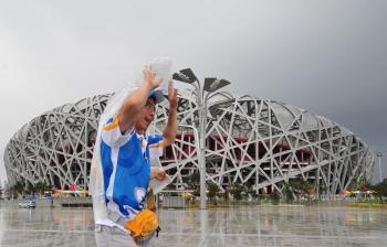 The Bird's Nest in Beijing. The China Meteorological Administration (CMA) is predicting a 40 percent chance of rain the day of the Olympics' opening ceremony. (AFP/Getty Images) The Bird's Nest in Beijing. The China Meteorological Administration (CMA) is predicting a 40 percent chance of rain the day of the Olympics' opening ceremony. (AFP/Getty Images)