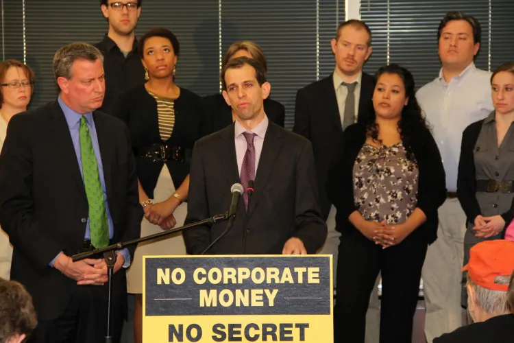 Bill de Blasio, the Public Advocate for the City of New York (left) and Robert Weissman (middle), the President of Public Citizen, launching 'Our Democracy is Not for Sale' initiative at the SEIU headquarters in Washington D.C. March 12. The initiative combines America's most prominent advocacy groups in asking corporate America not to use treasury funds to influence the U.S. elections, warning that they will use shareholder meetings, boycotts, rallies and the legal process to stop it. (Shar Adams/The Epoch Times)
