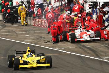 Ryan Briscoe pit crew services his car as Dario Franchitti, drives the #10 Target Chip Ganassi car down pit lane, during the first round of pit stops. Briscoe's second stop was disastrous. (Chris McGrath/Getty Images) Ryan Briscoe pit crew services his car as Dario Franchitti, drives the #10 Target Chip Ganassi car down pit lane, during the first round of pit stops. Briscoe's second stop was disastrous. (Chris McGrath/Getty Images)
