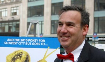 AND THE WINNER IS: Gene Russianoff declares the M42 bus the slowest, or 'pokiest' bus in the city at the 'Pokey and Schleppie' award ceremonies. (Tara MacIsaac/The Epoch Times)