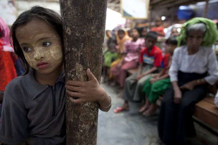 A Burmese girl stands in a malaria clinic in Arakan State, Burma (or Myanmar), in May 2009. According to a 2008 United Nations survey, Burma’s spending on health care, as percent of GDP, was the lowest in the world (0.3 percent). Recently, aid money has started to trickle back into the country. (Paula Bronstein/Getty Images)
